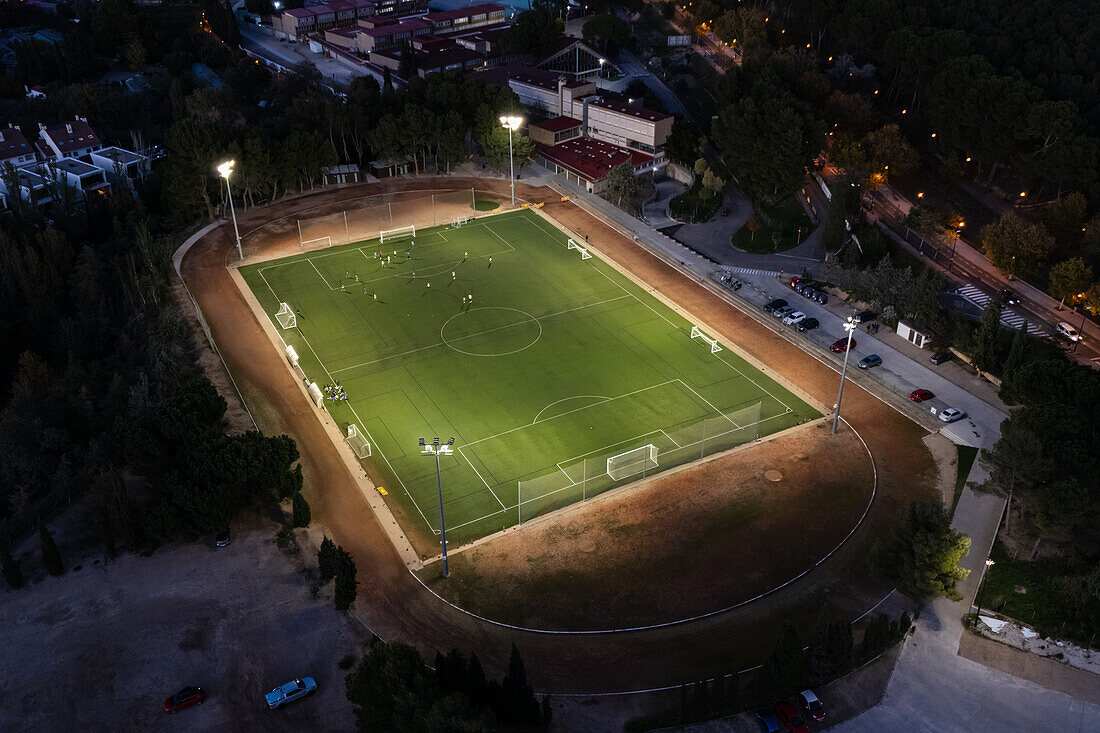 Aerial view of a training in a soccer field at night