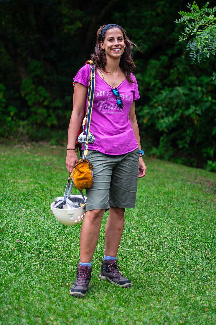 Young caucasian woman having fun during a Canopy tour in Costa Rica