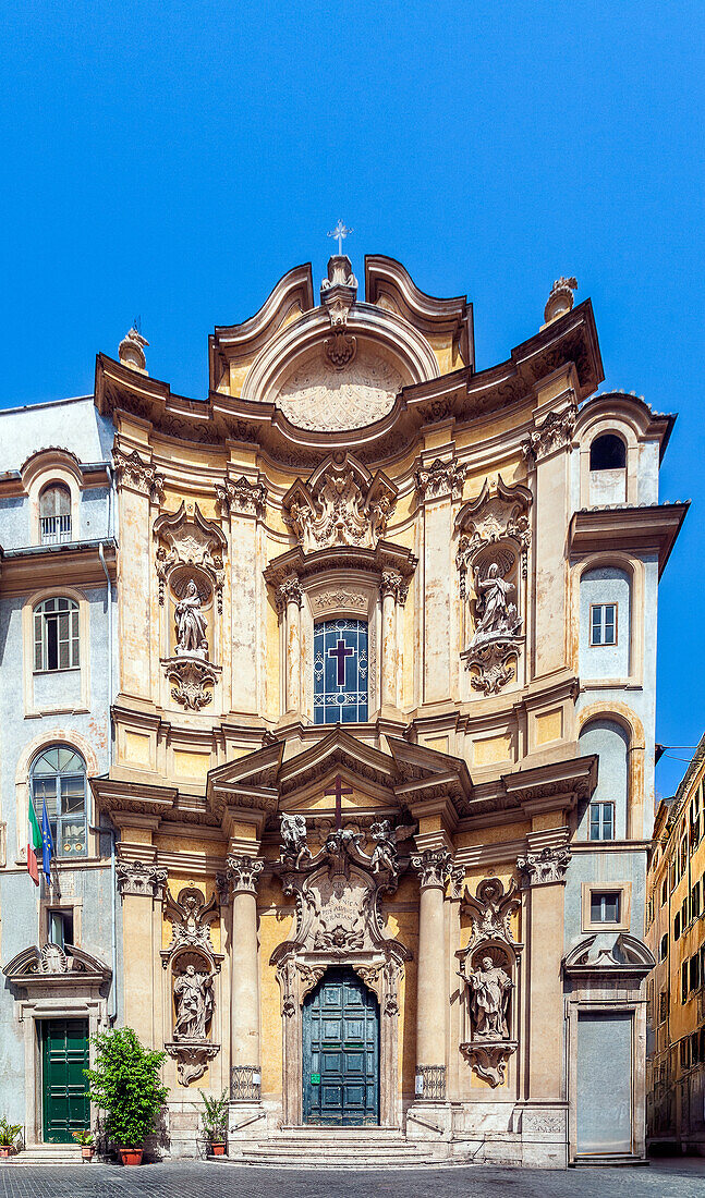 The ornate Rococo facade of Maddalena church showcases intricate sculptures and architectural details in the heart of Rome.