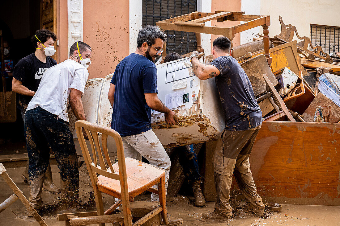 People cleaning. Effects of the DANA floods of October 29, 2024, Convent street, Paiporta, Comunidad de Valencia, Spain