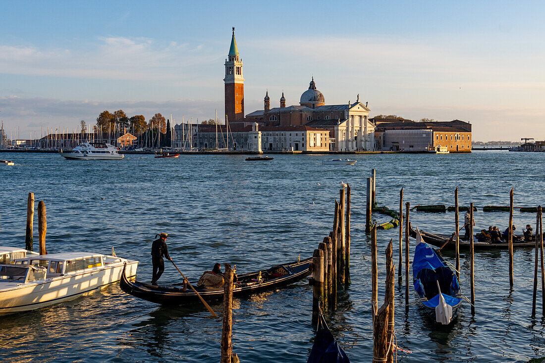 A gondola in front of the Benedictine church and bell tower of San Giorgio Maggiore in Venice, Italy.