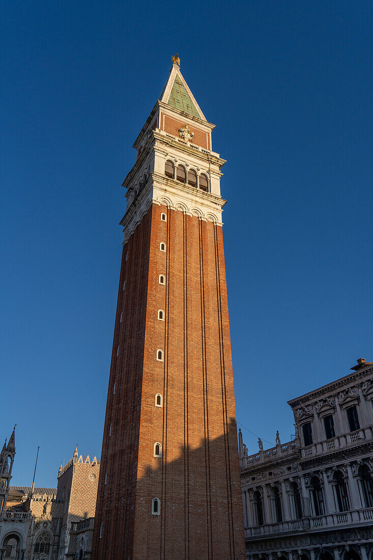 The campanile or bell tower of the Patriarchal Cathedral Basilica of Saint Mark or St. Mark's Basilica in Venice, Italy.