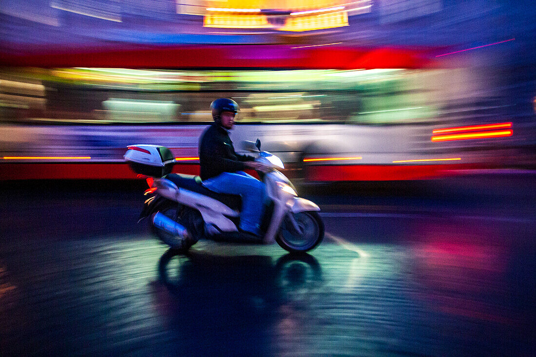 Rome, Italy, July 22 2017, A scooter zips through the vibrant streets of Rome, capturing the essence of Italian city life at dusk.