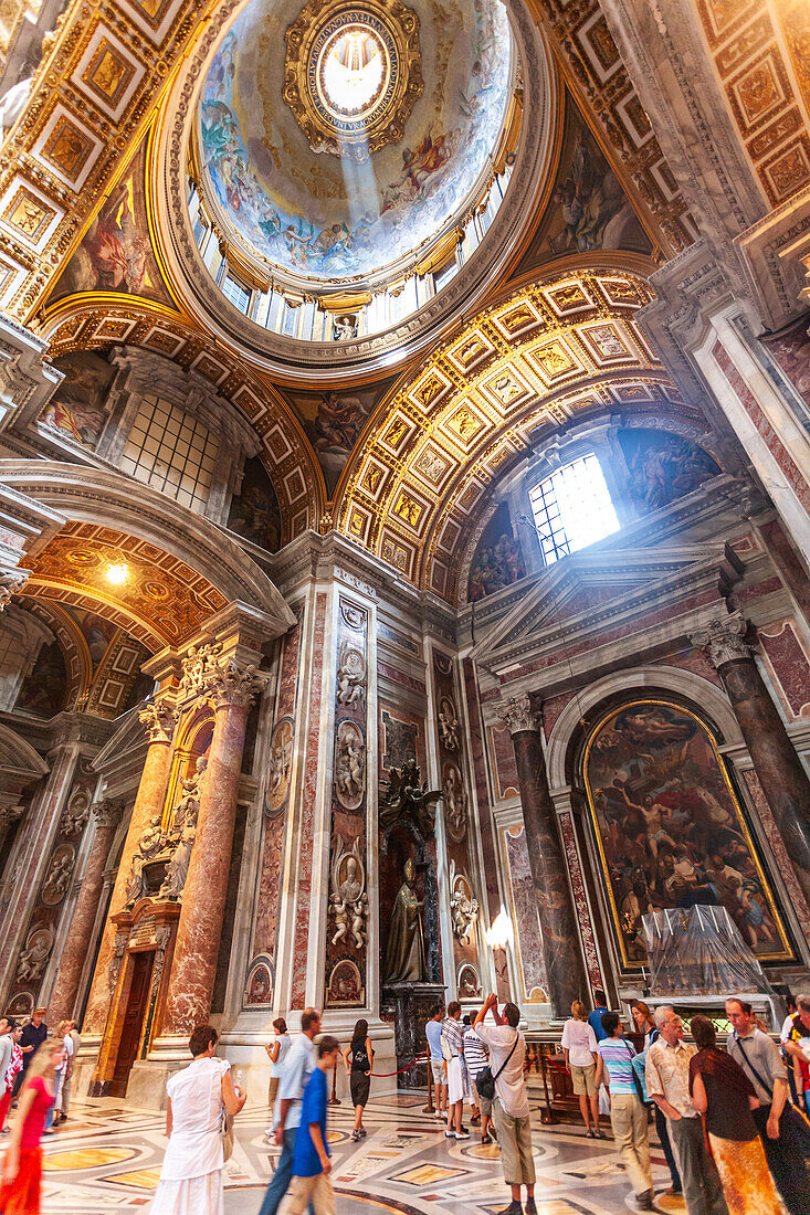 Rome, Italy, July 22 2017, Visitors admire the stunning architecture and art of the Chapel of Saint Sebastian in Saint Peter's Basilica, Vatican, during daylight.