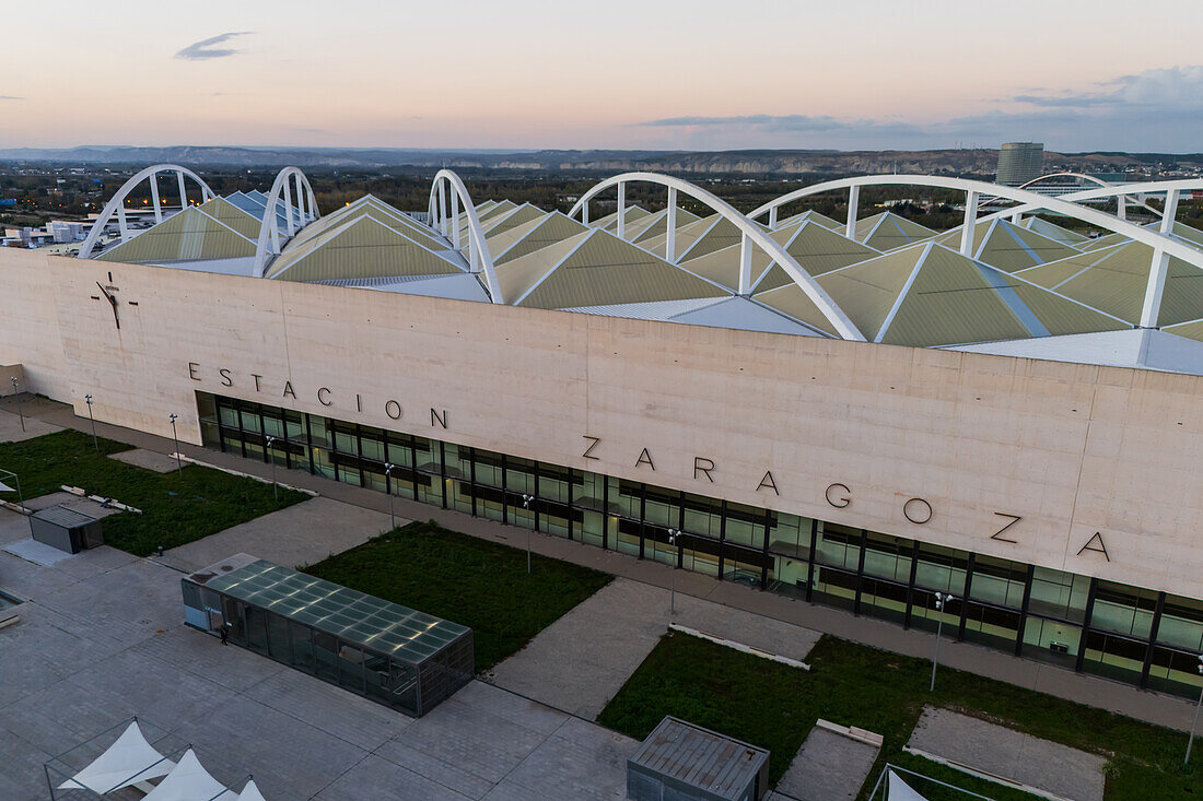 Aerial view of Zaragoza–Delicias railway and central bus station at sunset