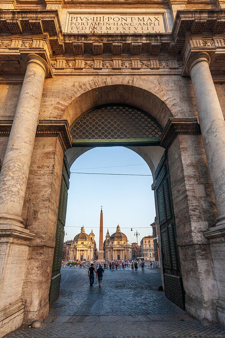 The Porta del Popolo frames a stunning glimpse of Rome's famous architecture.