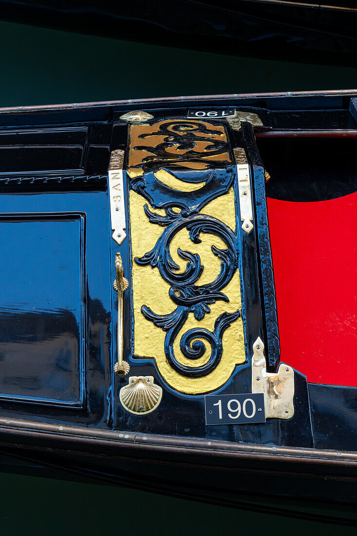 Detail of the traditional decoration of a gondola in Venice, Italy.