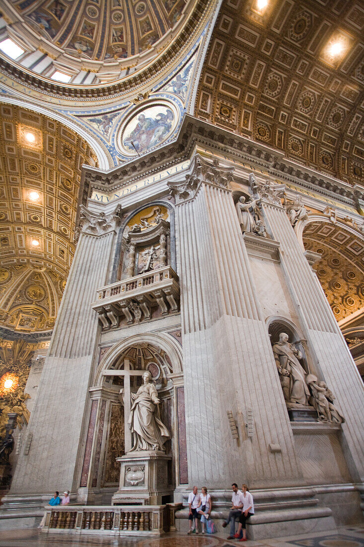 Rome, Italy, July 22 2017, The interior of Saint Peter's Basilica showcases the statue of Saint Helen holding a cross, created by Andrea Bolgi in 1635.