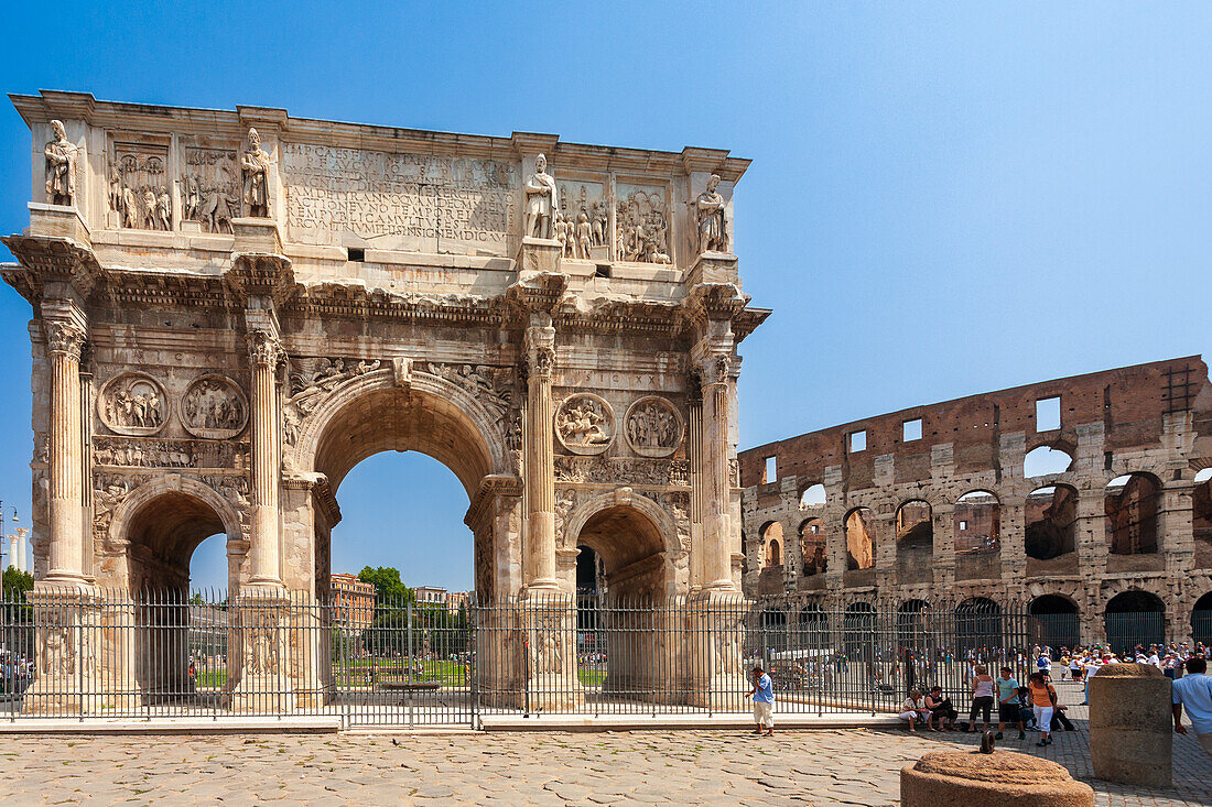 Rome, Italy, July 22 2017, The Arch of Constantine stands prominently with the Colosseum behind it under a clear sky in Rome.