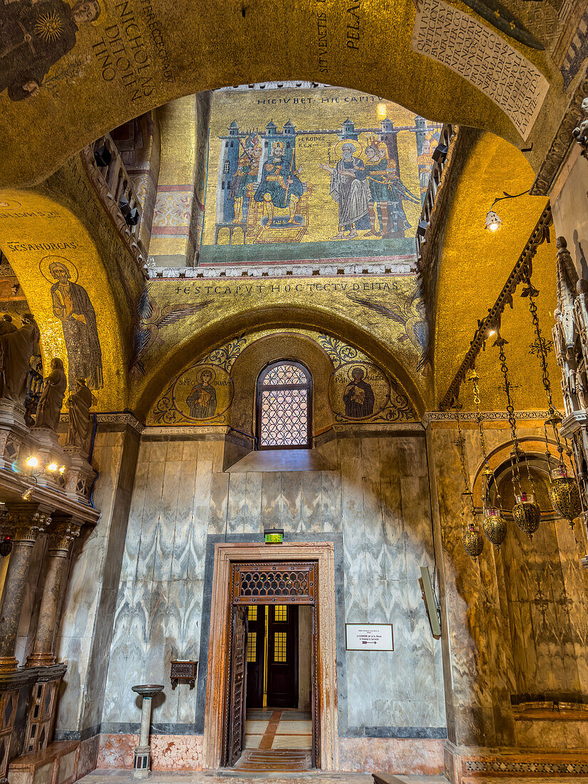 Gold mosaics in St. Mark's Basilica in Venice, Italy. The mosaic on this wall depicts Peter's meeting with King Herod.