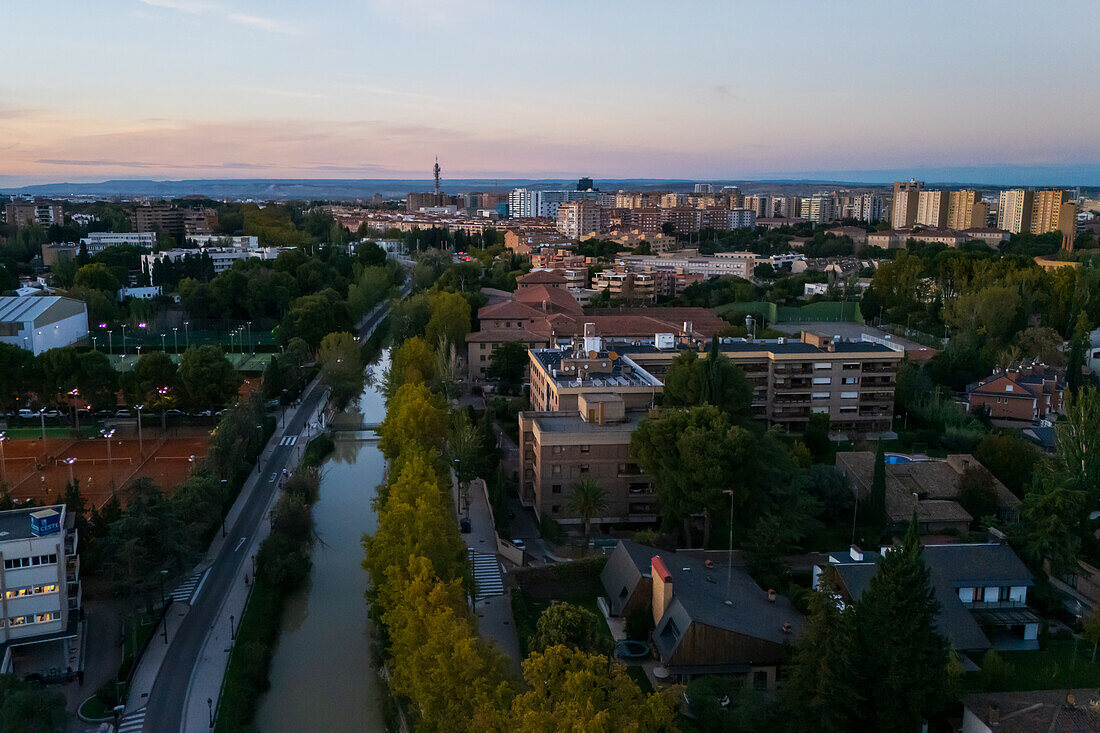 Aerial view of the Canal Imperial de Aragon in Zaragoza at sunset, Spain