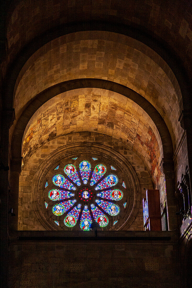 Lisbon, Portugal, March 1 2007, Beautiful stained glass window inside Se Cathedral in Lisbon, Portugal, showcasing intricate designs and vibrant colors, emphasizing the architectural beauty and historical significance of the cathedral.