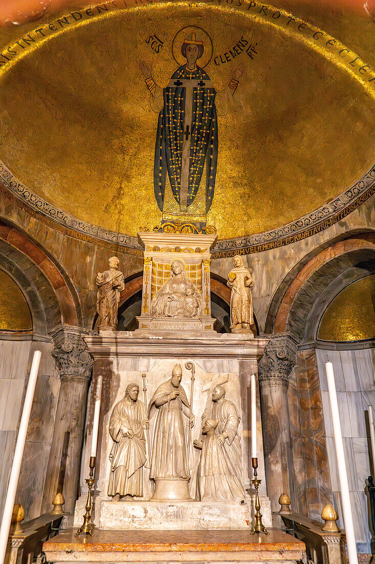 Bas relief sculptures and gold mosaics in St. Clement's Chapel in St. Mark's Basilica in Venice, Italy.