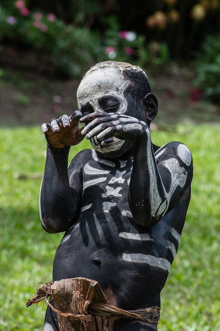 The Skeleton Men from the Omo Bugamo tribe of Papua New Guinea paint their bodies with black and white paint emulating the human skeleton, Chimbu Province, Papua New Guinea