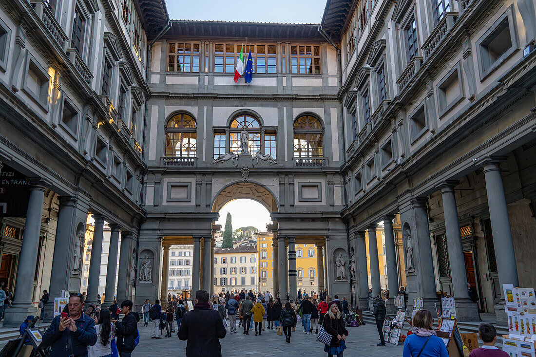 A view of tourists in the cortile or internal courtyard of the Uffizi Gallery in Florence, Italy.