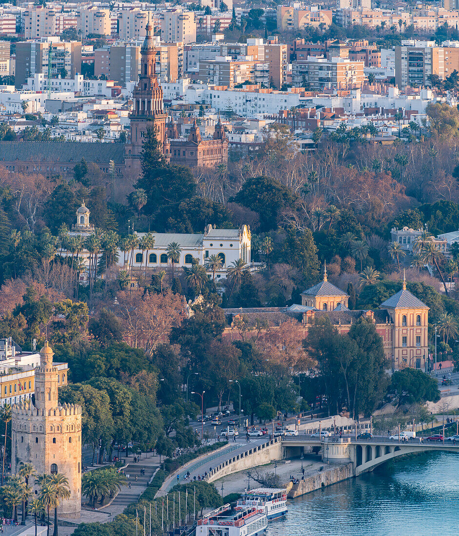 This aerial view showcases Torre del Oro, San Telmo Palace, and Plaza de Espaa amid Seville's urban landscape.