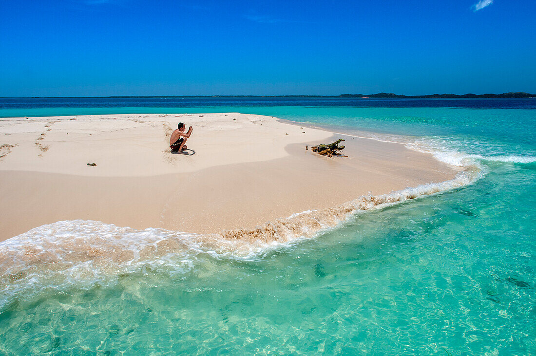 Tourists in a Isolated island uninhabited white sand beach, Île-à-Vache, Sud Province, Haiti