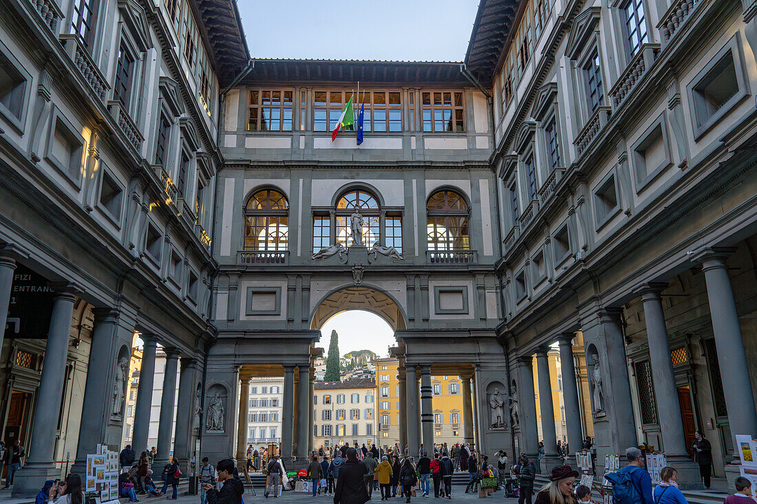 A view of tourists in the cortile or internal courtyard of the Uffizi Gallery in Florence, Italy.