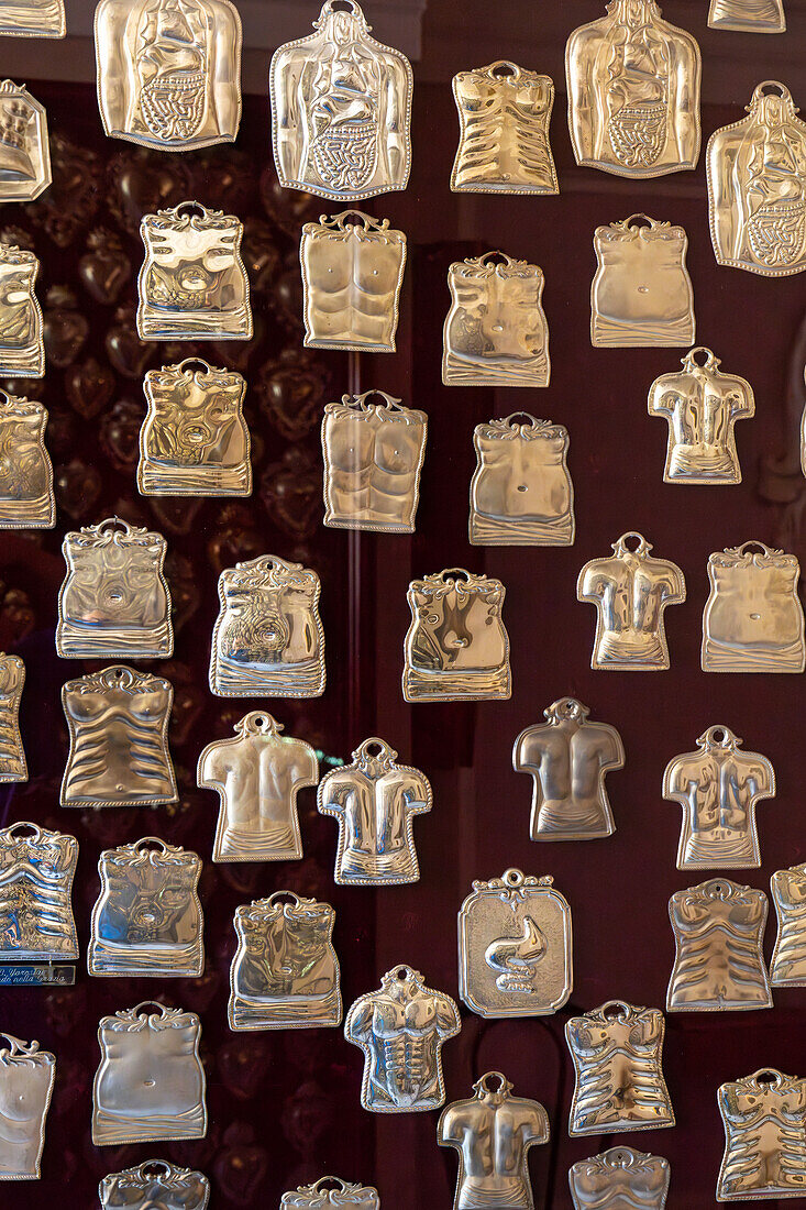 Silver talismen or offerings for blessings recieved in the crypt of the Basilica of Sant'Antonino, Sorrento, Italy.