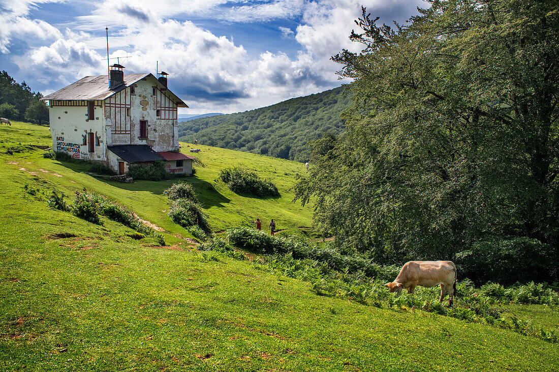 Trekking, Casa de los mikeletes house on the way to the San Adrián tunnel on the Aizkorri mountain range at the Basque Country, Goierri, Basque Highlands Basque Country, Euskadi Spain.