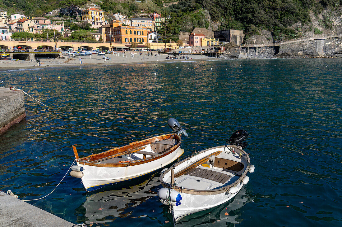 Two small fishing boats in the harbor of Monterosso al Mare, Cinque Terre, Italy.