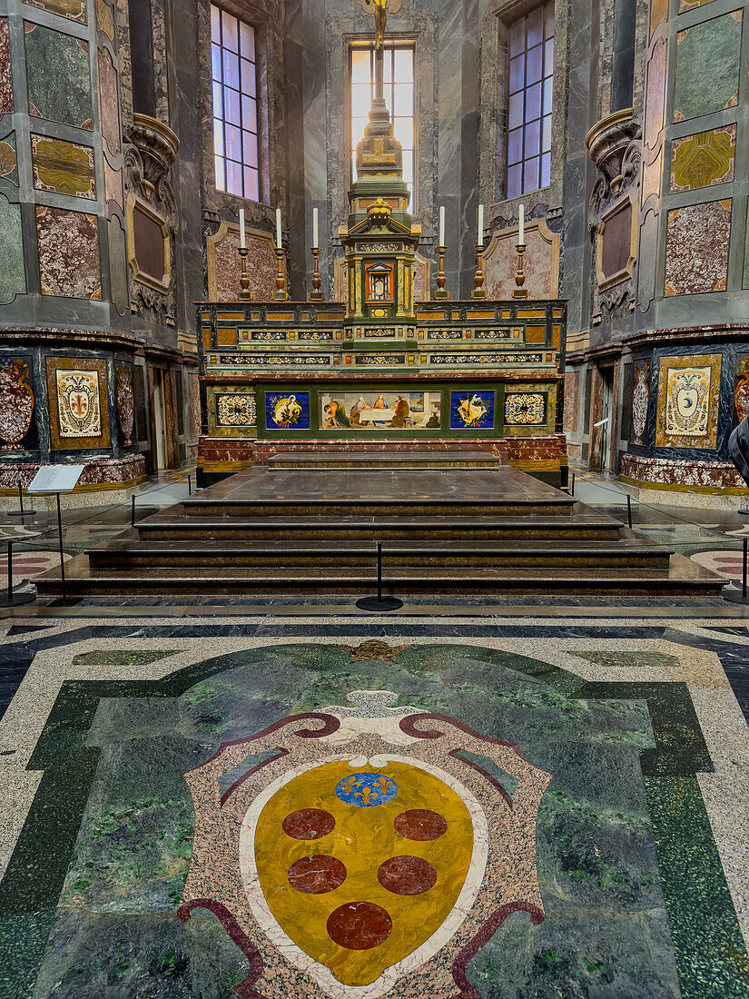 The Medici coat of arms in front of the altar in the Chapel of the Princes, Medici Chapel Museum, Florence, Italy. The coat of arms is made of inlaid semi-precious stones in a technique called commesso or Florentine mosaic.