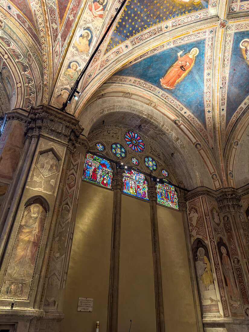 Medieval frescoes and stained glass windows in the Orsanmichele Church in Florence, Italy.