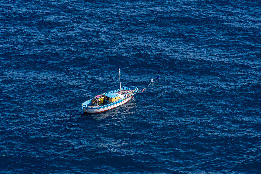 A small fishing boat moored in the Gulf of Salerno off the Amalfi Coast at Praiano, Italy.