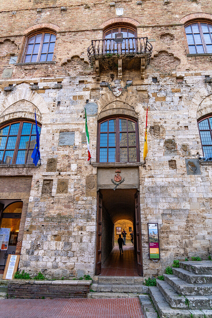 Facade of the 13th Century Palazzo Comunale, Palazzo del Popolo or city hall in San Gimignano, Italy.