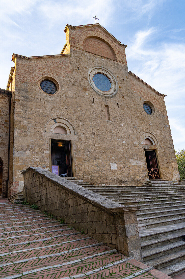 Facade of the Collegiata di Santa Maria Assunta Church on the Piazza del Duomo in San Gimingnano, Italy.