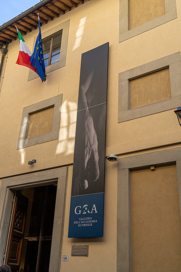 A sign on the exterior of the Accademia Gallery in Florence, Italy.