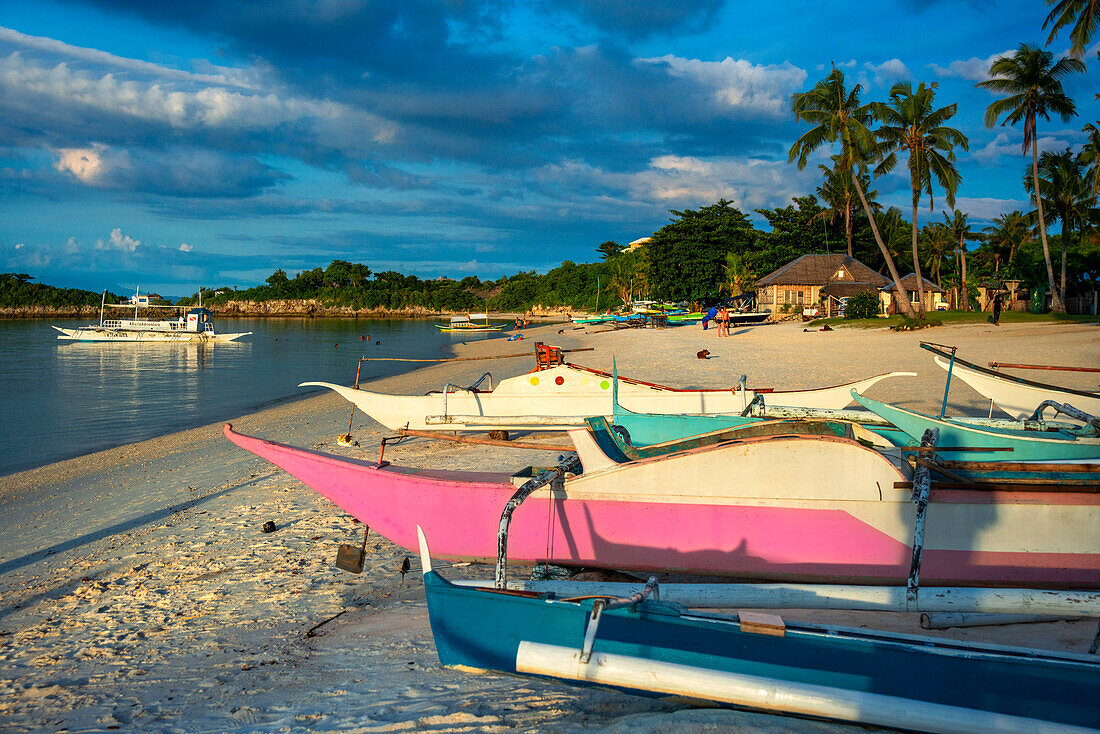 Local fish boats in white sand beach in of Langub Beach Malapascua island, Cebu, Philippines