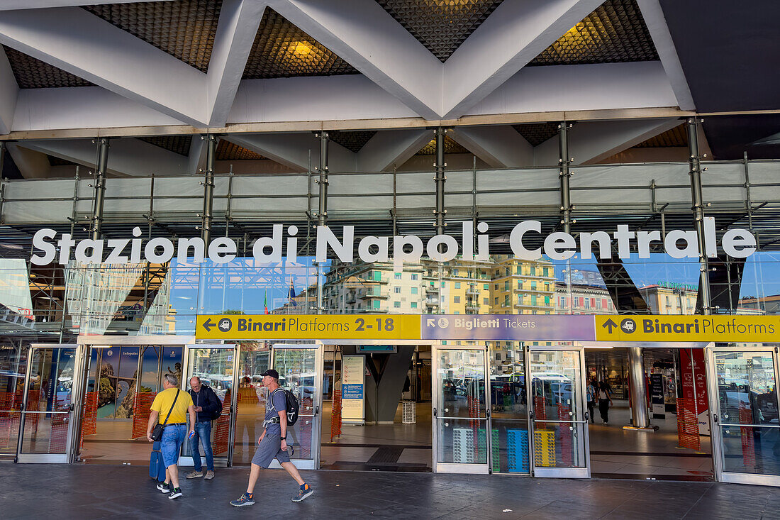 Passengers in front of the Central Train Station in Naples, Italy.