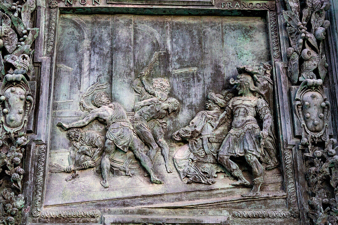 Detail of the right portal door of the Duomo of Pisa. Cast in bronze in 1605 by Giambologna. Pisa, Italy. This panel depicts the flagellation of Christ.