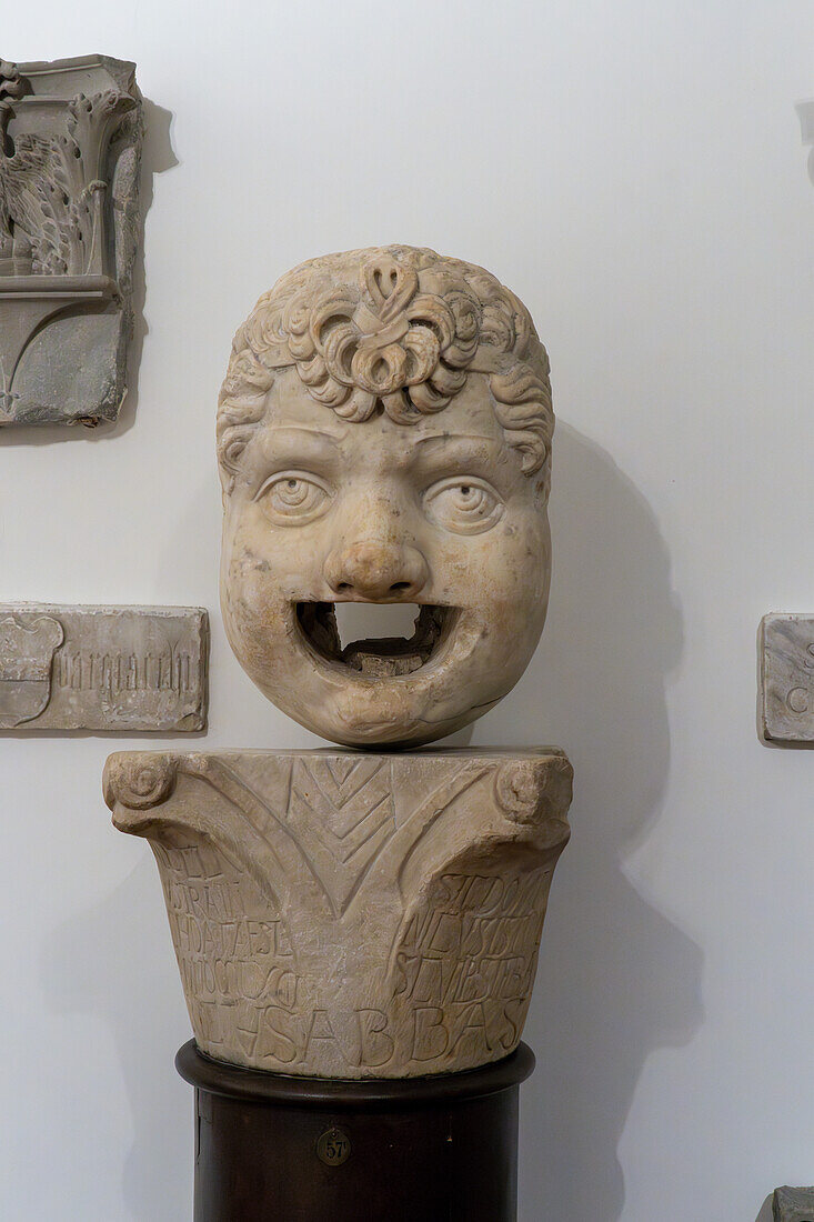 Carved marble gargoyle head in Lapidarium storico in the Duomo Museum in Florence, Italy. 16th Century A.D.