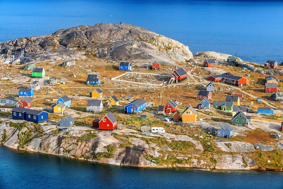 Coloful houses in the small isolated inuit village of Aappilattoq, South Greenland, Arctic sea.