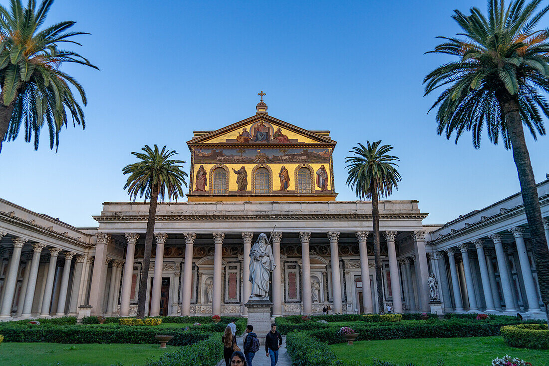 The statue of St. Paul and facade of the Basilica of St. Paul Outside the Walls, Rome, Italy.