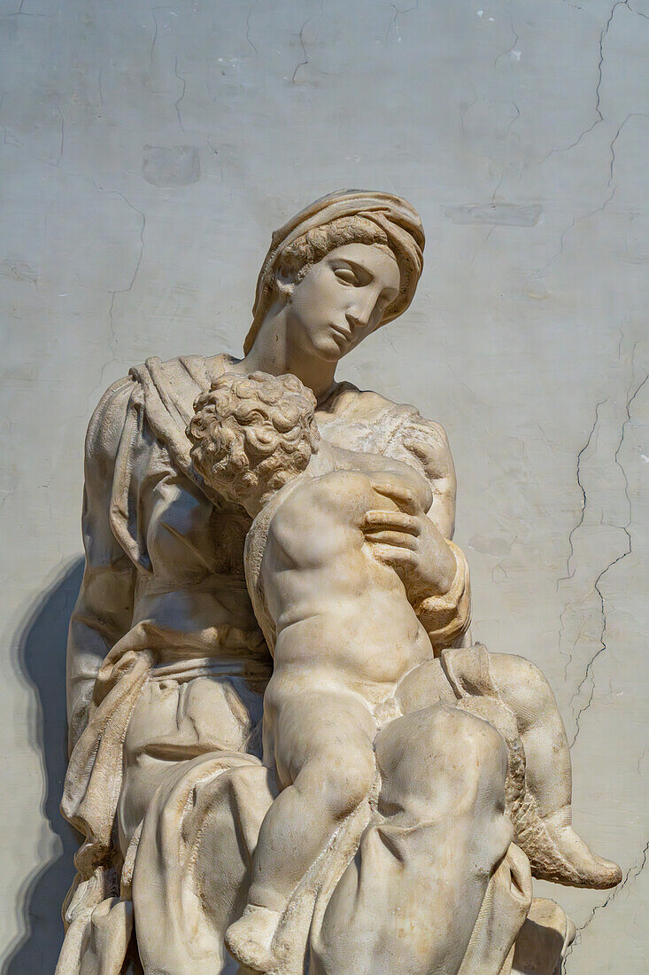 The Madonna and Child, by Michelangelo, in the Medici Chapel Museum. Florence, Italy. The statue sits atop the tomb of Lozenzo the Magnificent de Medici.