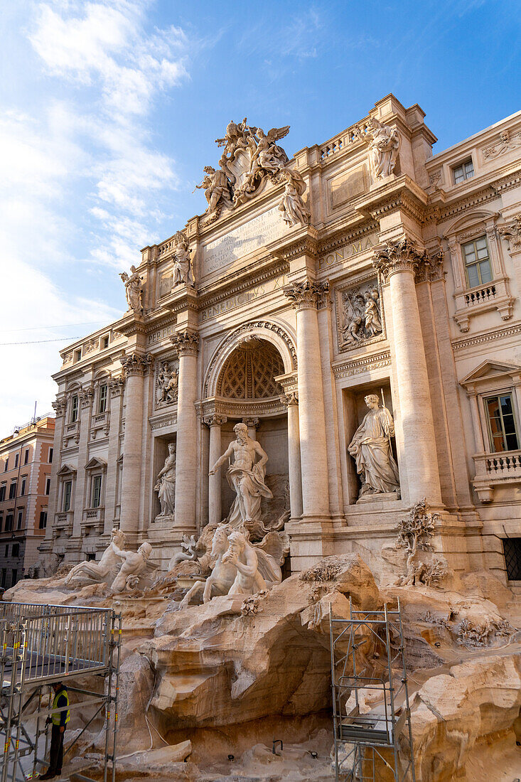 The Trevi Fountain on the rear of the Palazzo Poli in the Piazza di Trevi in Rome, Italy. The fountain is undergoing restoration in this image.