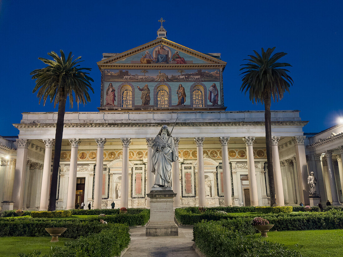 The statue of St. Paul and facade of the Basilica of St. Paul Outside the Walls, Rome, Italy.