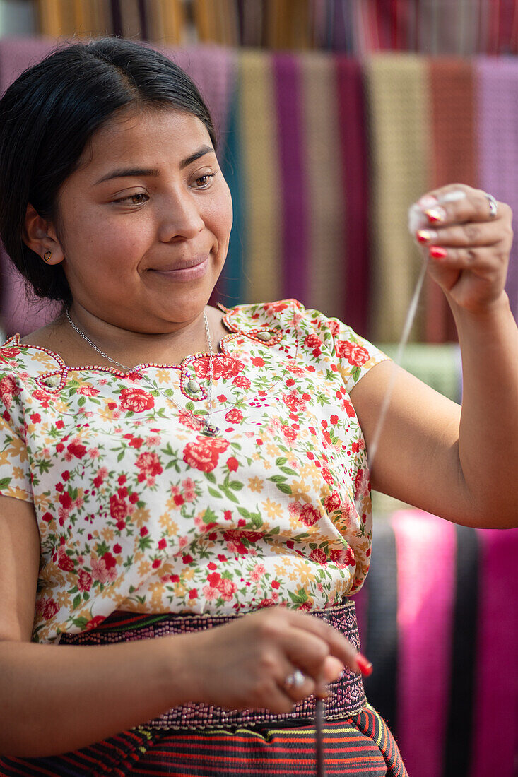 Woman spinning Cotton San Juan la Laguna, Lake Atitlan, Guatemala