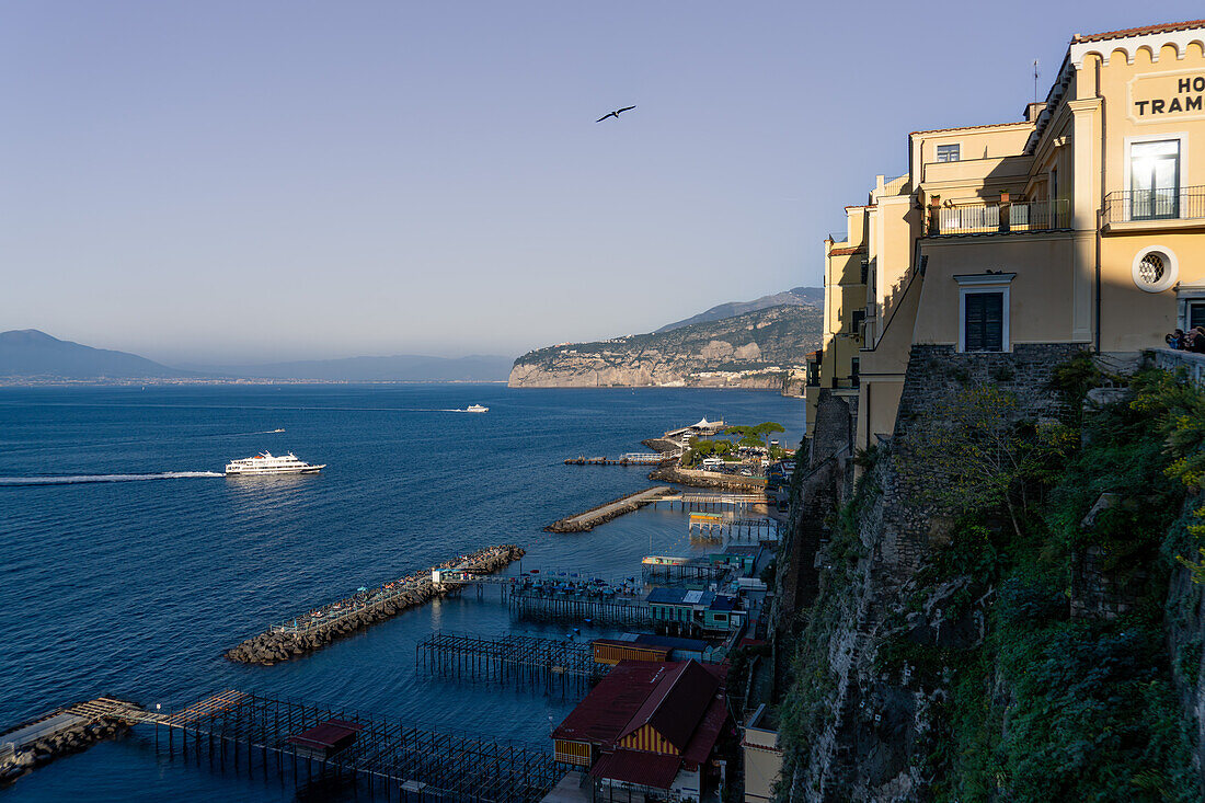 High-speed passenger ferries approach the Marina Piccola harbor in Sorrento, Italy.