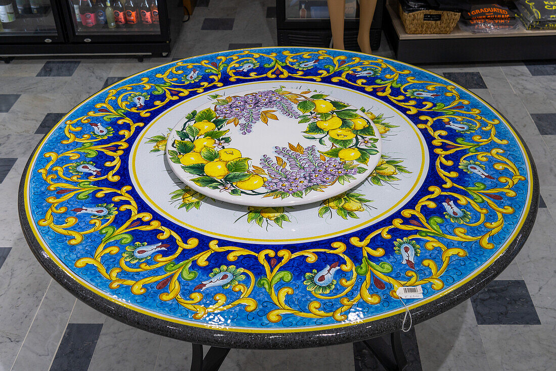 A ceramic coffee table with a lemon motif design in the Campaniadamare shop in Sorrento, Italy.