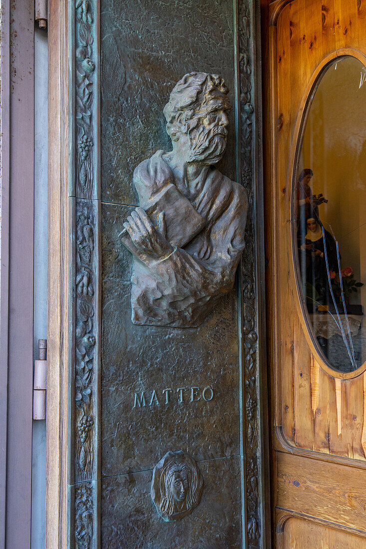 A bas relief of St. Matthew on the bronze door of the Church of San Gennaro in Vettica Maggiore, Praiano, Italy.