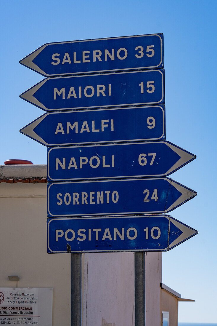 Road signs on SS163 in the resort town of Praiano, Italy, on the Amalfi Coast of the Gulf of Salerno.