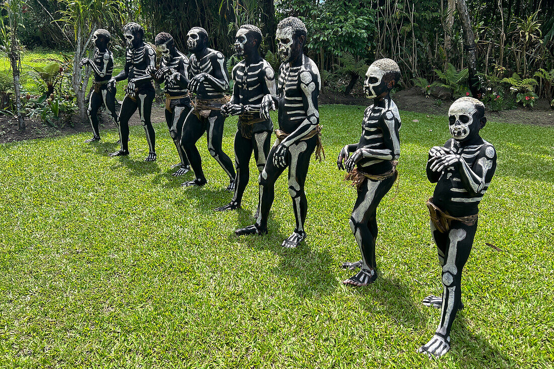 The Skeleton Men from the Omo Bugamo tribe of Papua New Guinea paint their bodies with black and white paint emulating the human skeleton, Chimbu Province, Papua New Guinea