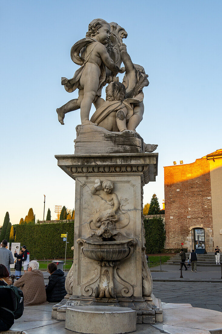 The Fontana dei Putti, or Fountain with Angels, in Piazza dei Miracoli by the Leaning Tower. Pisa, Italy. Sculpted by Giovanni Antonio Cybei in the 1600s.