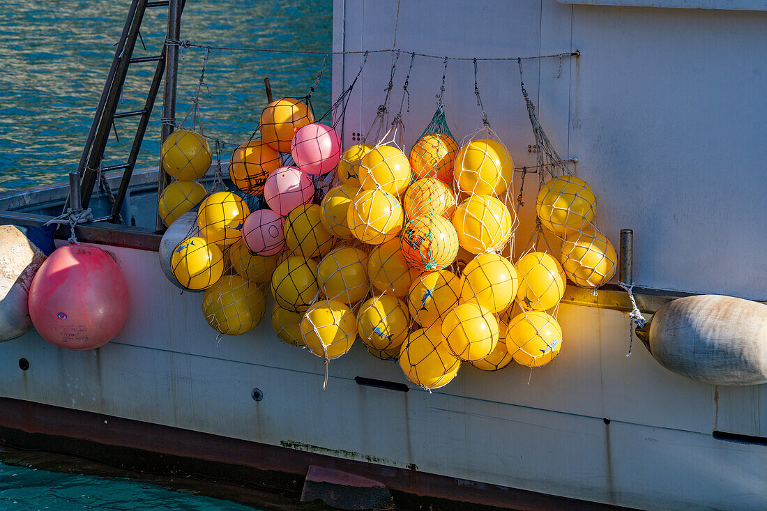 Colorful floats for fishing nets on a fishing boat in the harbor of Monterosso al Mare, Cinque Terre, Italy.