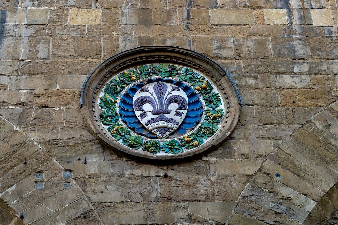 The fleur di lis representing Florence on the Orsanmichele Church in Florence, Italy.