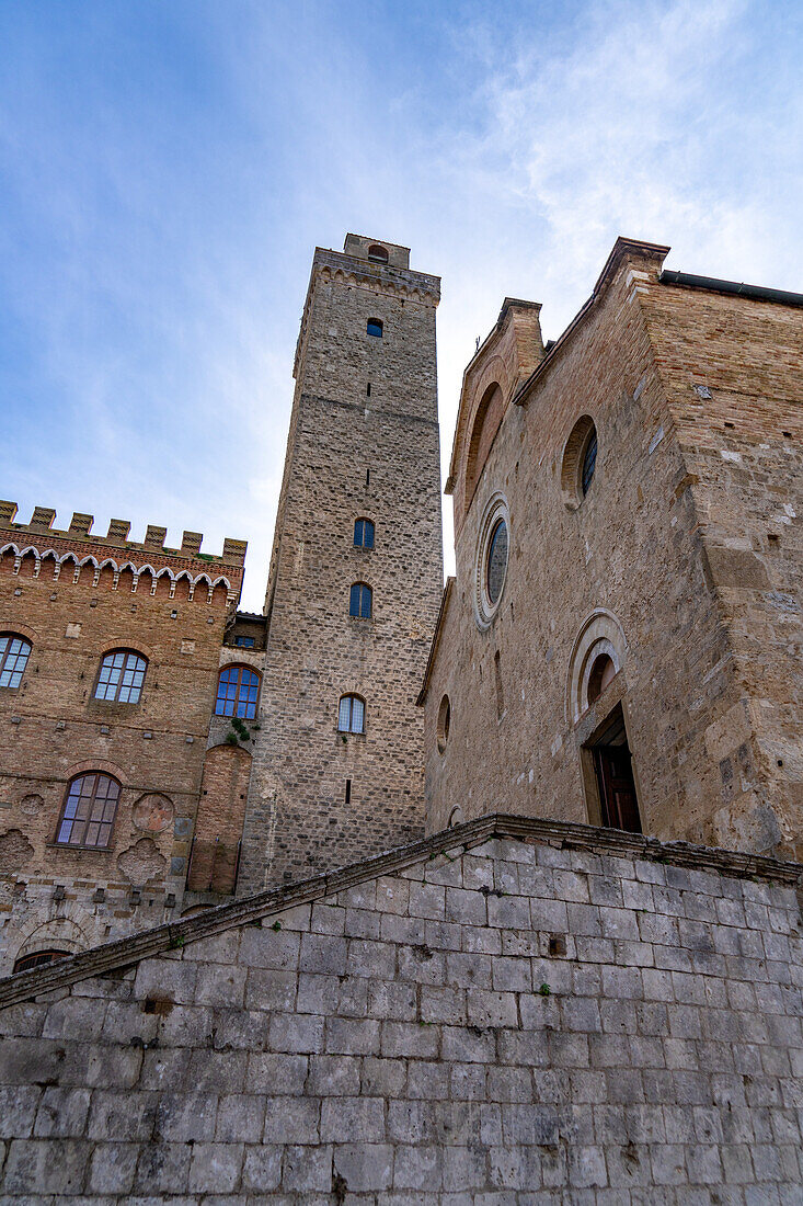 Facade of the Palazzo Comunale, Torre Grossa & Collegiata di Santa Maria Assunta Church. San Gimingnano, Italy.